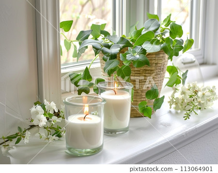 Springtime home decor, spring interior decorations with flowers and burning candles, bright white apartment in daylight 113064901