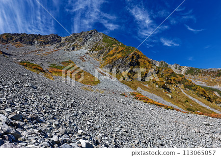 Mt. Kitahotaka seen from Karasawa Curl in the Northern Alps with autumn leaves 113065057