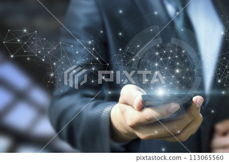 A man shows a phone that works in a connection network. A man shows a phone that works in a connection network. 113065560
