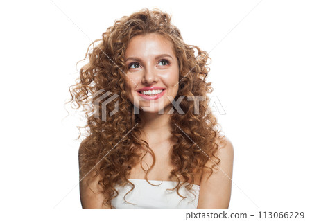 Laughing good-looking redhead woman with clean skin, curly hairstyle and natural make-up. Laughing good-looking redhead woman with clean skin, curly hairstyle and natural make-up. 113066229