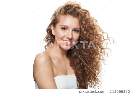 Isolated woman face. Young model with healthy skin, long hair and makeup on white background 113066250