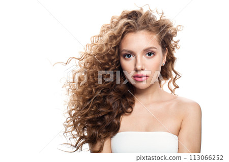Glorious good-looking redhead woman with clean skin, curly hairstyle and natural make-up. Glorious good-looking redhead woman with clean skin, curly hairstyle and natural make-up. 113066252