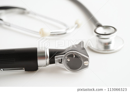 Otoscope isolated on white background for otolaryngologist or ENT physician doctor examining senior patient ear, hearing loss problem. Otoscope isolated on white background for otolaryngologist or ENT physician doctor examining senior patient ear, hearing loss problem. 113066323