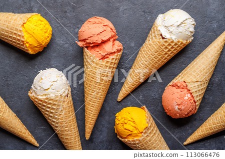 Assorted ice cream flavours in delightful waffle cones 113066476