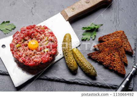 Savory beef tartare and brown bread toasts Savory beef tartare and brown bread toasts 113066492