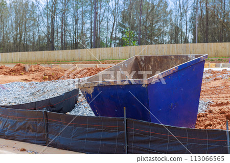 On construction site, metal container dumpster is used to store construction junk recycling waste On construction site, metal container dumpster is used to store construction junk recycling waste 113066565