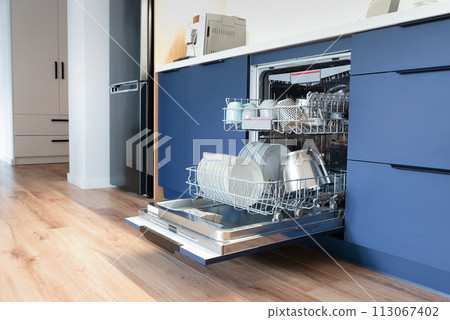 Dishwasher in modern blue kitchen 113067402