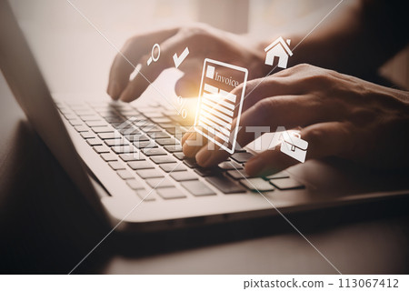 Man typing on a laptop. Invoice concept 113067412