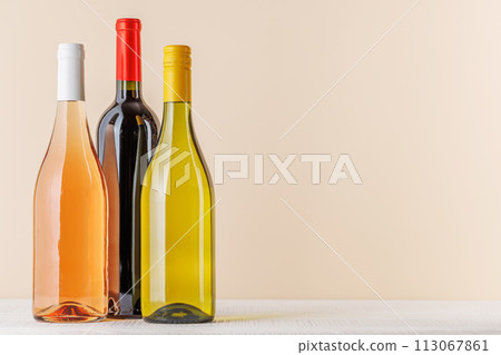 Red, Rose and White Wine Bottles on Table Red, Rose and White Wine Bottles on Table 113067861