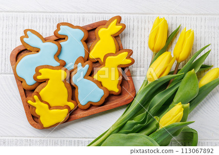 Easter Bunny-Shaped Gingerbread Cookies, Yellow Tulips 113067892