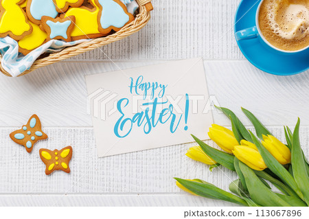 Easter Bunny-Shaped Gingerbread Cookies, Yellow Tulips, and Coffee Cup Easter Bunny-Shaped Gingerbread Cookies, Yellow Tulips, and Coffee Cup 113067896