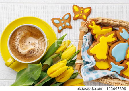 Easter Bunny-Shaped Gingerbread Cookies, Yellow Tulips, and Coffee Cup 113067898