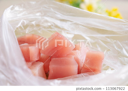 Diced tuna in a plastic bag 113067922