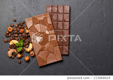 Two chocolate bars isolated on stone background Two chocolate bars isolated on stone background 113068024
