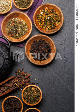 A collection of various teas nestled in wooden bowls 113068088