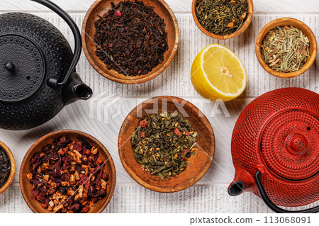 A collection of various teas nestled in wooden bowls A collection of various teas nestled in wooden bowls 113068091