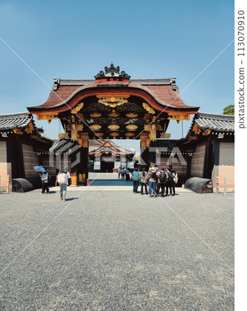 Tourist Entering The Gates Of A Temple Tourist Entering The Gates Of A Temple 113070910