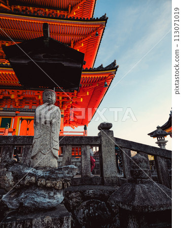 Old Statue Above A Red Pagoda 113071019