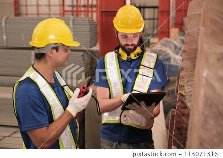 Team of engineers working at the factory 113071316