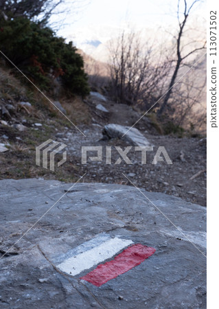 Marking of a long-distance hiking route, white and red, Itineraries in France, Marking on rock Marking of a long-distance hiking route, white and red, Itineraries in France, Marking on rock 113071502