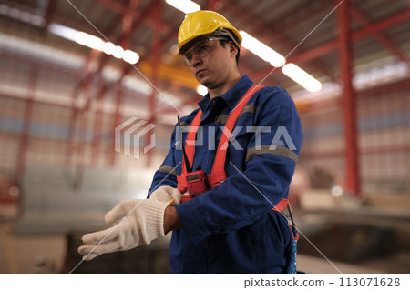 Team of engineers working at the factory 113071628