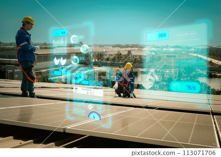 Engineers install solae cell on the roof of factory 113071706
