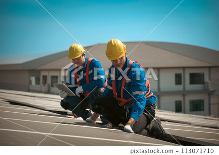 Engineers install solae cell on the roof of factory Engineers install solae cell on the roof of factory 113071710