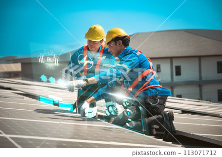 Engineers install solae cell on the roof of factory 113071712