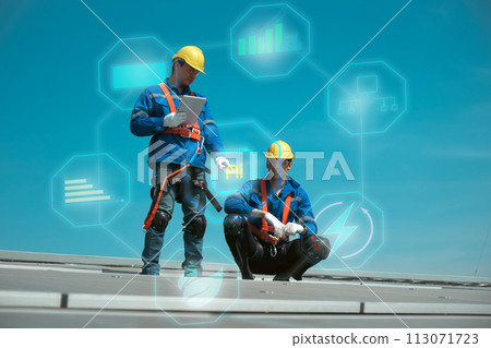 Engineers install solae cell on the roof of factory 113071723