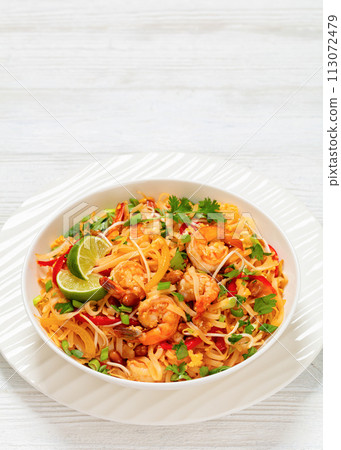 pad thai with shrimps, peanuts, eggs, bean sprouts 113072479