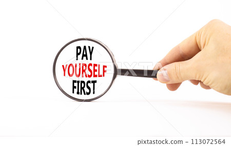 Pay yourself first symbol. Concept words Pay yourself first in beautiful magnifying glass. Beautiful white table white background. Businessman hand. Business and pay yourself first concept. Copy space Pay yourself first symbol. Concept words Pay yourself first in beautiful magnifying glass. Beautiful white table white background. Businessman hand. Business and pay yourself first concept. Copy space 113072564