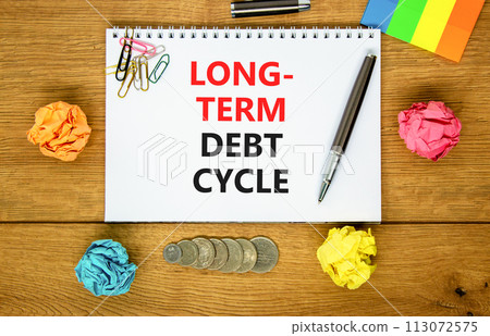 Long-term debt cycle symbol. Concept words Long-term debt cycle on beautiful white note. Beautiful wooden table background. Colored paper. Black pen. Business Long-term debt cycle concept. Copy space. 113072575