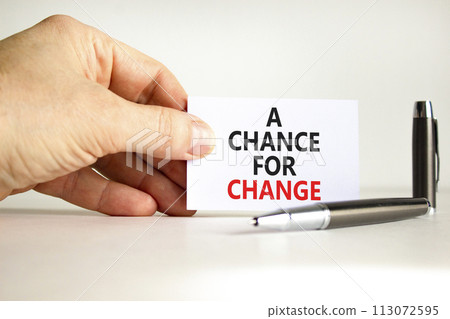 A chance for change symbol. Concept words A chance for change on beautiful white paper. Beautiful white background. Voter hand. Business A chance for change concept. Copy space. A chance for change symbol. Concept words A chance for change on beautiful white paper. Beautiful white background. Voter hand. Business A chance for change concept. Copy space. 113072595