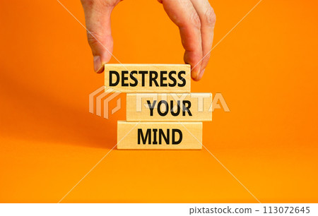 Destress your mind symbol. Concept words Destress your mind on wooden blocks. Doctor hand. Beautiful orange table orange background. Psychological business and destress your mind concept. Copy space. Destress your mind symbol. Concept words Destress your mind on wooden blocks. Doctor hand. Beautiful orange table orange background. Psychological business and destress your mind concept. Copy space. 113072645