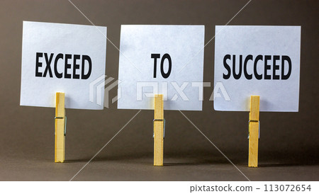 Exceed to succeed symbol. Concept words Exceed to succeed on beautiful white paper on clothespin. Beautiful grey table grey background. Business and exceed to succeed concept. Copy space. Exceed to succeed symbol. Concept words Exceed to succeed on beautiful white paper on clothespin. Beautiful grey table grey background. Business and exceed to succeed concept. Copy space. 113072654