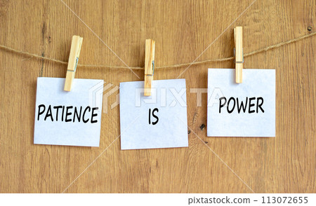 Patience is power symbol. Concept words Patience is power on beautiful white paper on clothespin. Beautiful wooden table wooden background. Business and patience is power concept. Copy space. 113072655