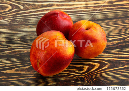 Ripe sweet juicy fresh red nectarines Ripe sweet juicy fresh red nectarines 113072862
