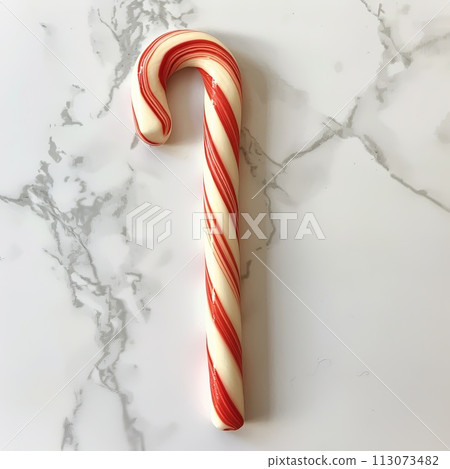 striped red and white candy cane on a white background 113073482