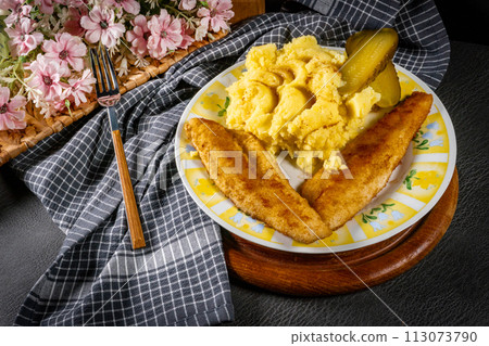 Fried pieces of breaded zander. Fried pieces of breaded zander. 113073790