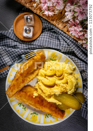 Fried pieces of breaded zander. Fried pieces of breaded zander. 113073792