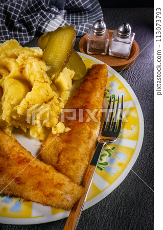 Fried pieces of breaded zander. Fried pieces of breaded zander. 113073793