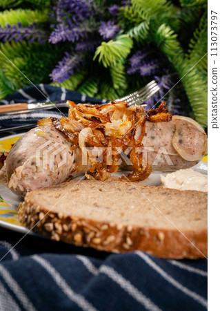 Fried white sausage with onion. Fried white sausage with onion. 113073797