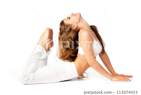 young woman doing fitness exercises on a white background 113074053