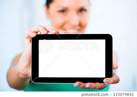 young smiling brunette woman holding a touch pad 113074642