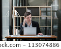 Handsome well dressed businessman working at his office, businessman working on a project 113074886