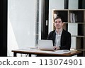 Handsome well dressed businessman working at his office, businessman working on a project 113074901