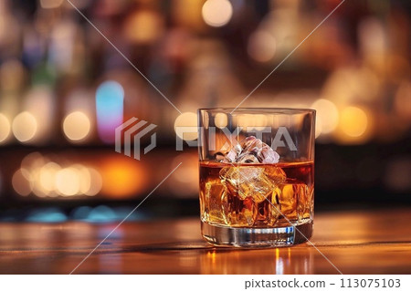 A glass of whiskey with ice A glass of whiskey with ice 113075103