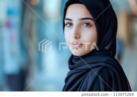 Close-up portrait of beautiful arabic woman in black hijab 113075269