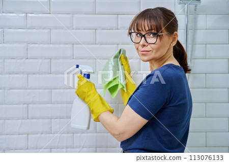 Woman with detergent spray rag cleaning bathroom Woman with detergent spray rag cleaning bathroom 113076133