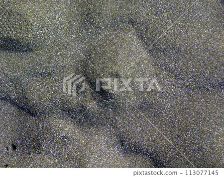 Background from black sand. Sand on the beach. Coast of the Black Sea. Background from black sand. Sand on the beach. Coast of the Black Sea. 113077145